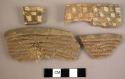 Corrugated potsherds with incised lines and smoothed sections