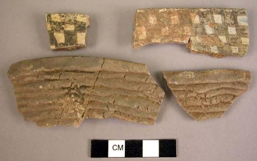 Corrugated potsherds with incised lines and smoothed sections