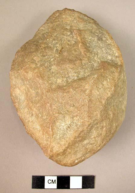 Small oval bifacial quartzite fist axe with original cortex adhering to the butt