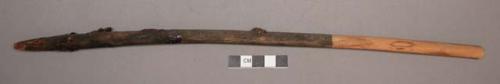 Wood, Prayer stick, pointed at both ends, painted black on lower half, charred