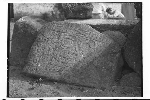 Stone slab with low relief carving of death head