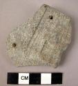 Carved stone rim sherd