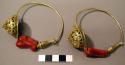 Pair of gold and coral ear ornaments