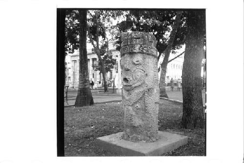 One large stone figure (front & left side)