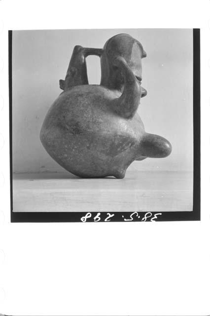 Human effigy pot with spout (right profile)