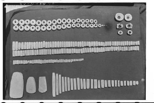 Jadeite and green stone beads. ear plugs, and solid cylinders./(over)/Top row: u