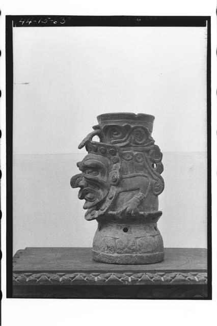 Side view of 44-15-62 [Pottery vase with head]