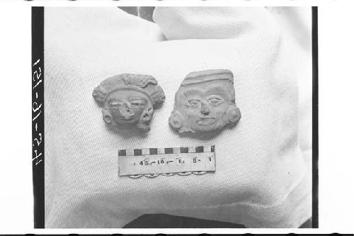 Two Pottery Figurine Heads