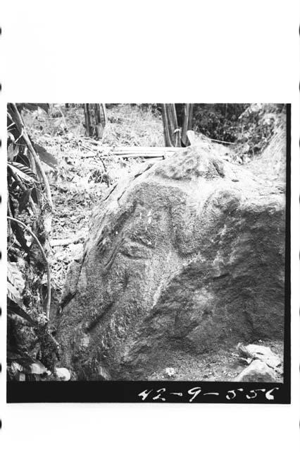 Boulder sculptured with crude human figure