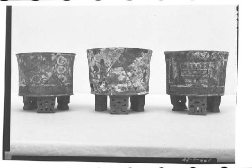 Mound B, Tomb V, stuccoed and painted cylindrical tripod vessels