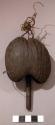 Leg rattle, palm nut shell with 1 wood clapper, fibre attachment, lele