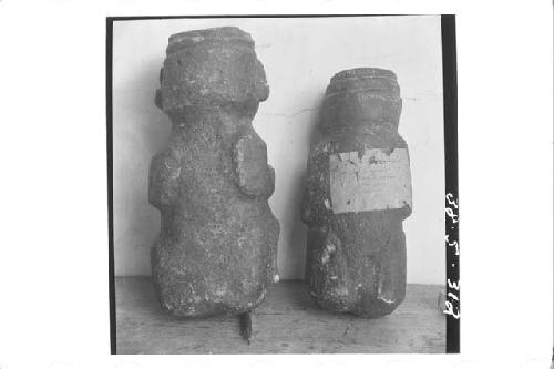 Back of 2 small stone figures