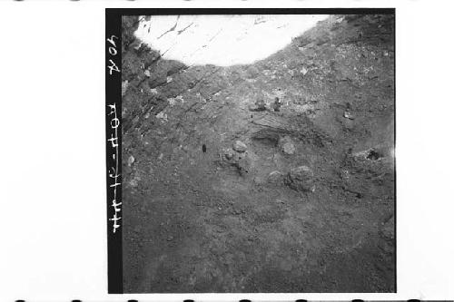 Panorama of tomb after removal of lajas.  Lower rt. -pots smashed.  Pyrite mirro