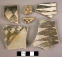 Ceramic rim and body sherds black on white checks, stacked connected diamonds