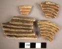 Plain corrugated potsherds, coils very prominent