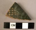 Rim potsherd - dark green on tan glaze