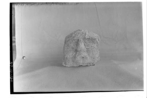 Human head of stucco.  Cat. No. 5054 from Structure B-XIII