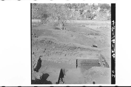 Looking down and W. across Str. 2A. trench T-45-1 in center foreground with part