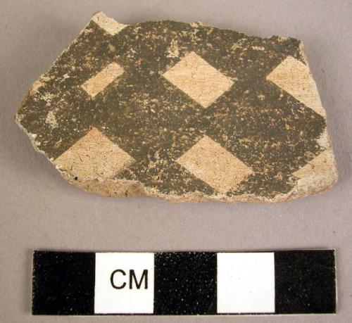 Potsherd, black-on-white inside, and corrugated outside