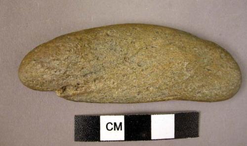 Elongated flat pebble, kidney-shaped with traces of smoothing or polishing - by