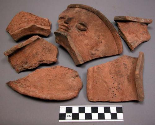 Ceramic rim sherds, orange, 1 with molded anthropomorphic features at side