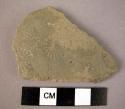 Potsherd - shiny grey surface outside; dull grey inside, stamp decorated ware