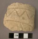Ceramic neck sherd, thick walled, white ware, incised zig zag design