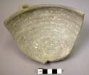 Broken shallow gray pottery vessel with handles (5 sherds)