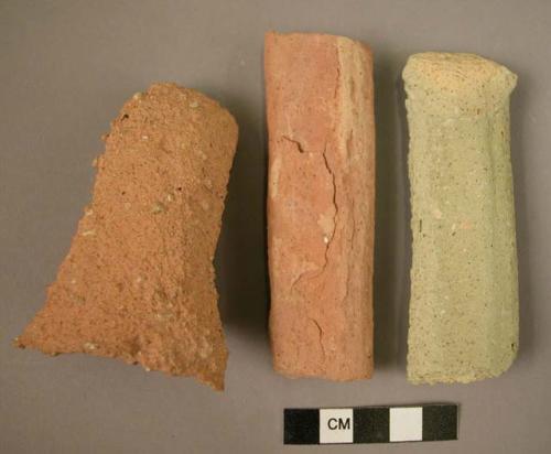 Potsherds (5); vessel handle fragments.