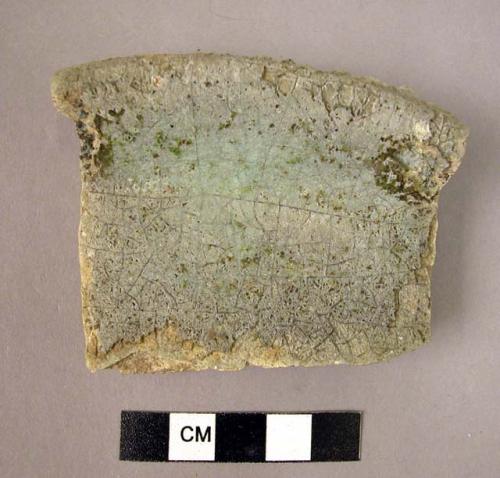 Ceramic rim sherd, white glazed interior, blue glazed exterior