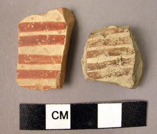 2 red line on cream slip ware sherds