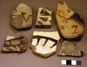 Ceramic rim and body sherds, black on white, red on white, geometric