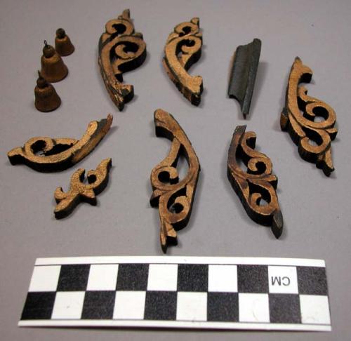 Ornament, carved wood scroll fragments and bells, black and gold paint