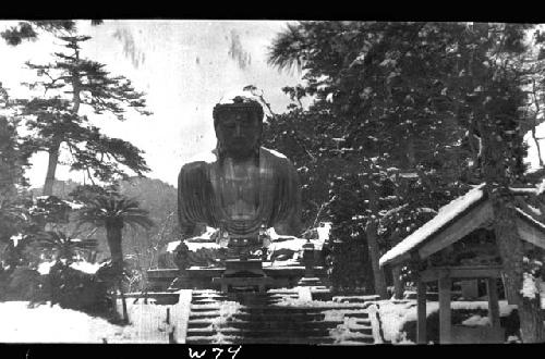 Snow-covered giant Buddha statue