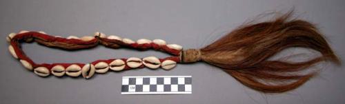 Necklace, cow's tail and cowrie shell