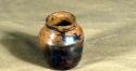 Eccentric vessel, eccentric painted ware. brown on buff. 6.7 x 5.6 cm.