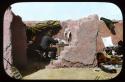Lantern slide of people working inside of ruins, hand-colored