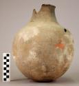 Jar of smooth black ware, incised decoration with rocker stamp