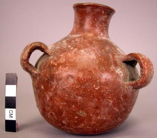 Ceramic red burninshed 3 handled jug.