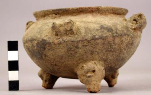 Small tripod pottery vessel with adornos