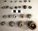 Ten miscellaneous small jade tubular and spheroid beads - some decomposed