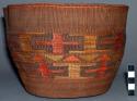 Basket with design in browns and red