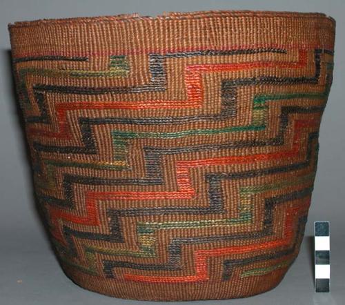 Basket--step design of orange, brown, green in false embroidery