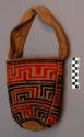 Woven cotton bag with shoulder strap; designs in red, purple and blue +