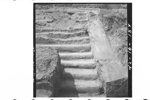 North steps of platform, Ph IIIa. Cement over adobe construction. Lower portion