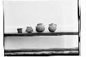 1 flower pot found under Stela B and 3 jars found under Stela I, ceremonial