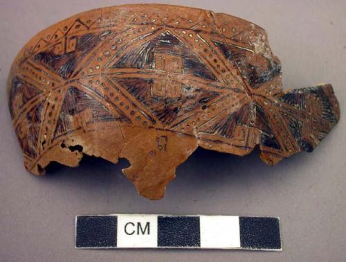 Fragment of decorated gourd - pattern made by burning around rim with +