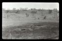 Lantern slide of desert landscape with pits in foreground