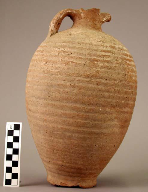 Two handled jar of red brown ware, worn white slip