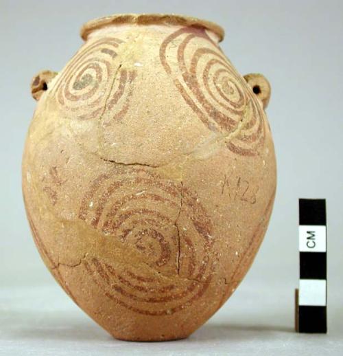 Pottery small jar, same type as B411, but decorated with spirals